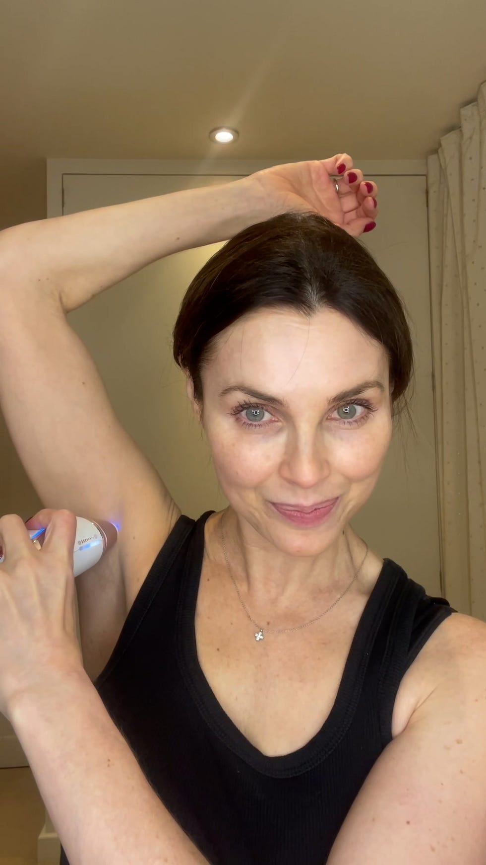 using a hair removal device on underarm area