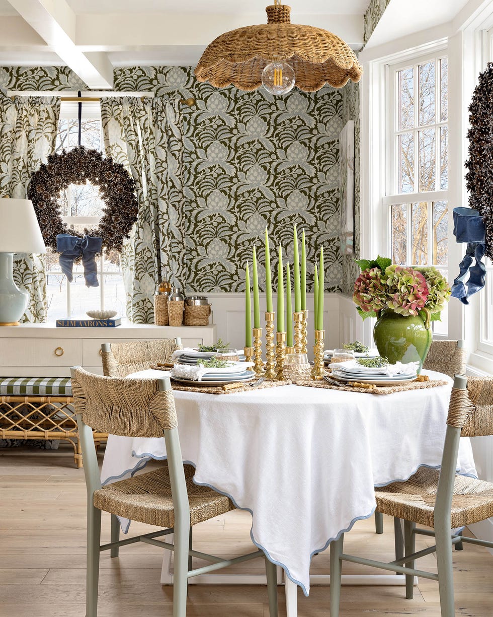 Dining area featuring a table set with plates and candles