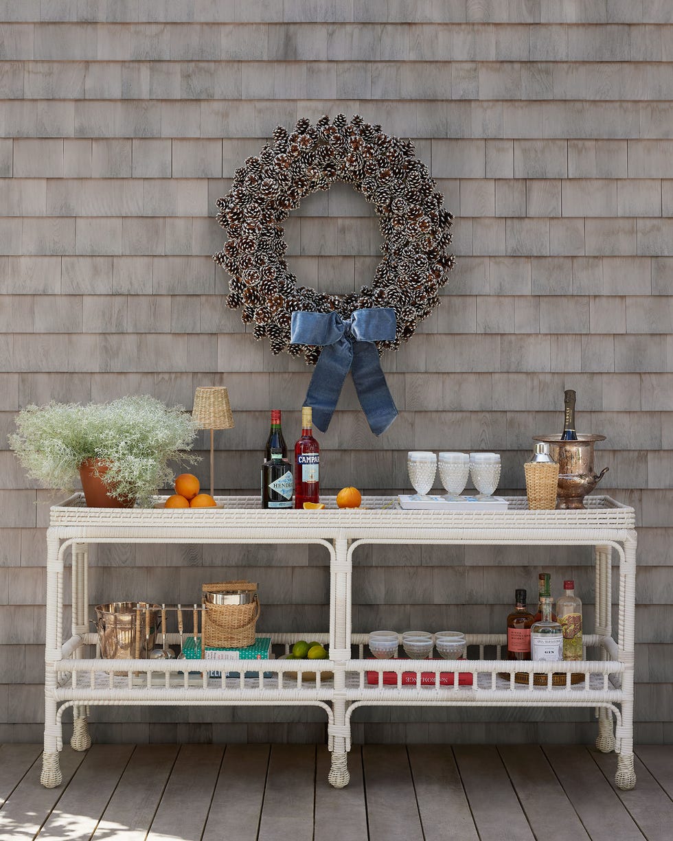 Outdoor bar setup outdoor bar setup with a pinecone wreath and various drinks