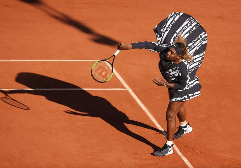 Serena Williams wears a Virgil Abloh poncho on court