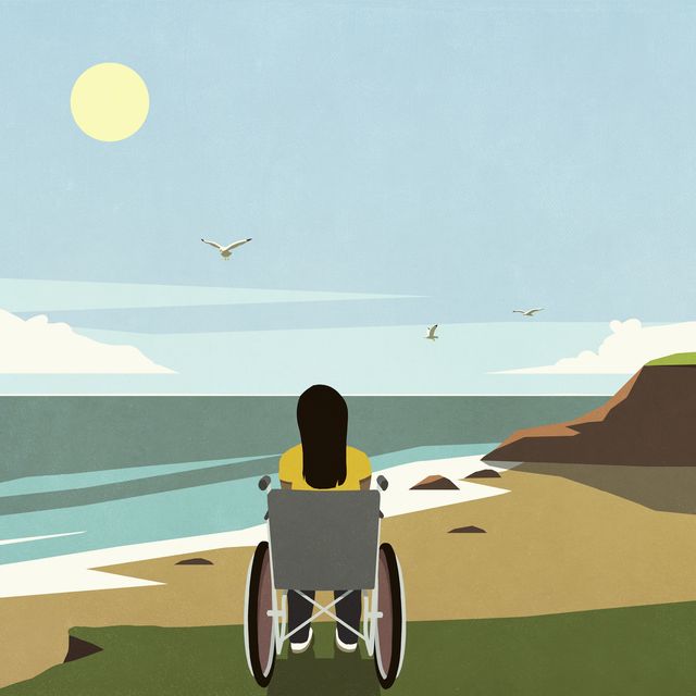 serene woman in wheelchair looking at idyllic summer ocean beach view from cliff