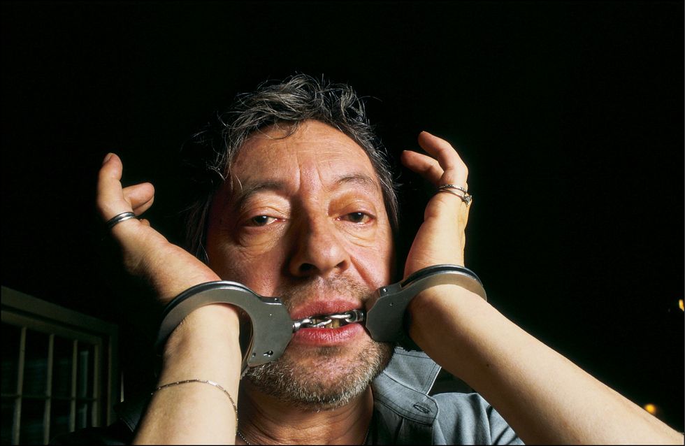 serge gainsbourg, portraits with handcuffs in paris, france in october,1987