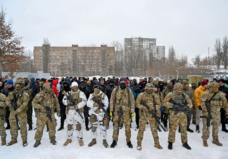 topshot military instructors and civilians stand prior to a training session at an abandoned factory in the ukrainian capital of kyiv on january 30, 2022 as fears grow of a potential invasion by russian troops massed on ukraine's border, within the framework of the training there were classes on tactics, paramedics, training on the obstacle course the training is conducted by instructors with combat experience, members of the public initiative "total resistance" photo by sergei supinsky afp photo by sergei supinskyafp via getty images