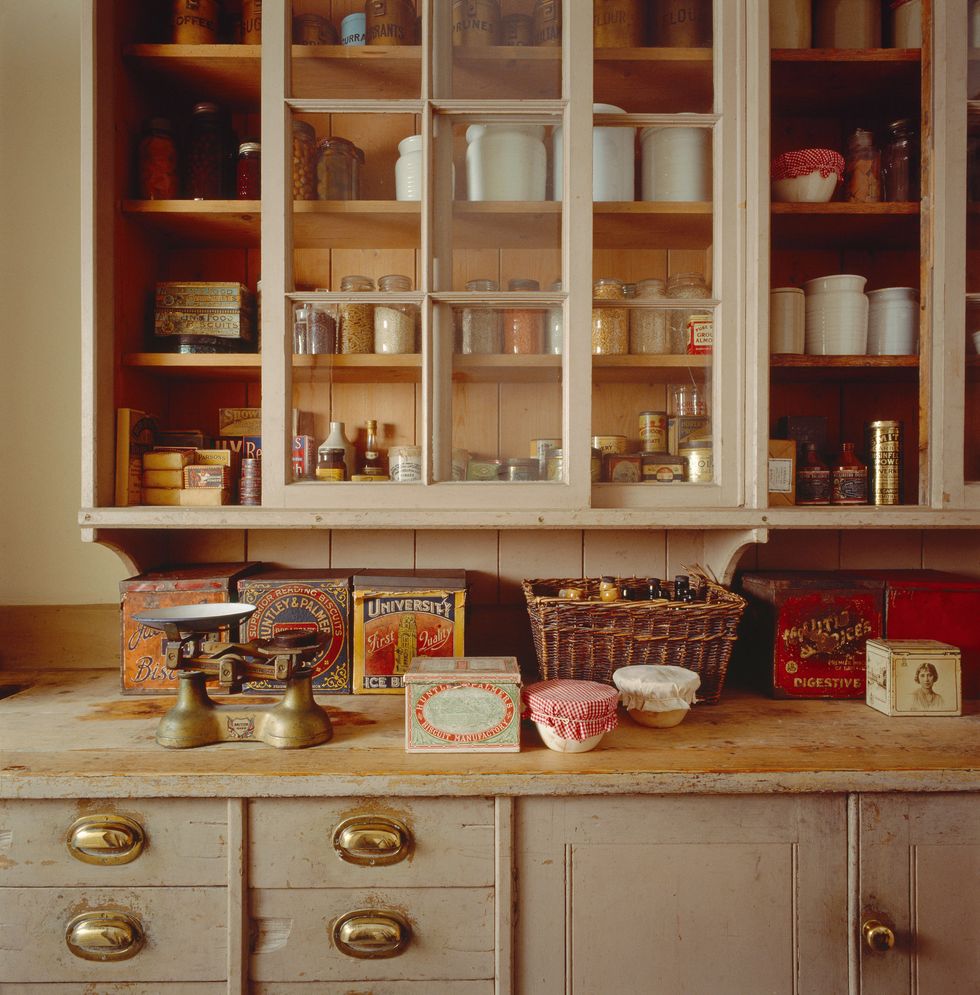 Victorian period organised pantry interior with old antique storage  stoneware jars