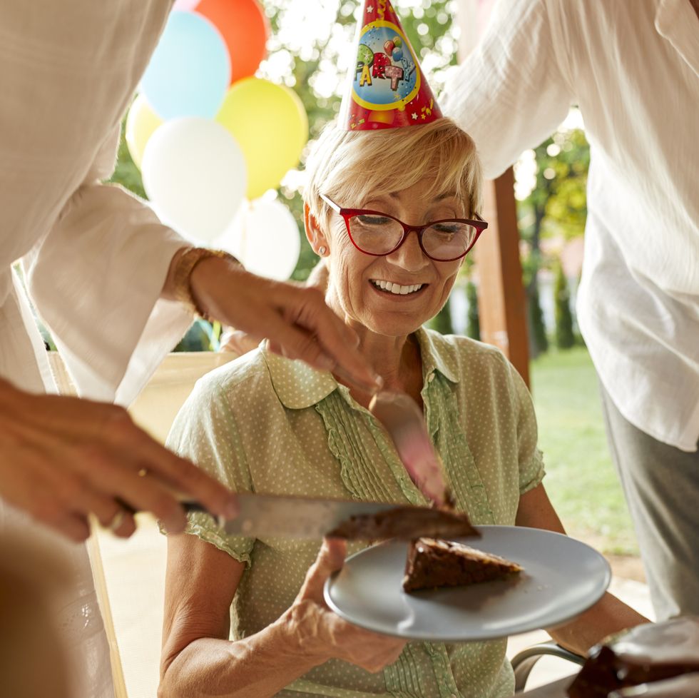 serving cake on a birthday garden party