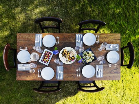 set dinner table outside on grass lawn