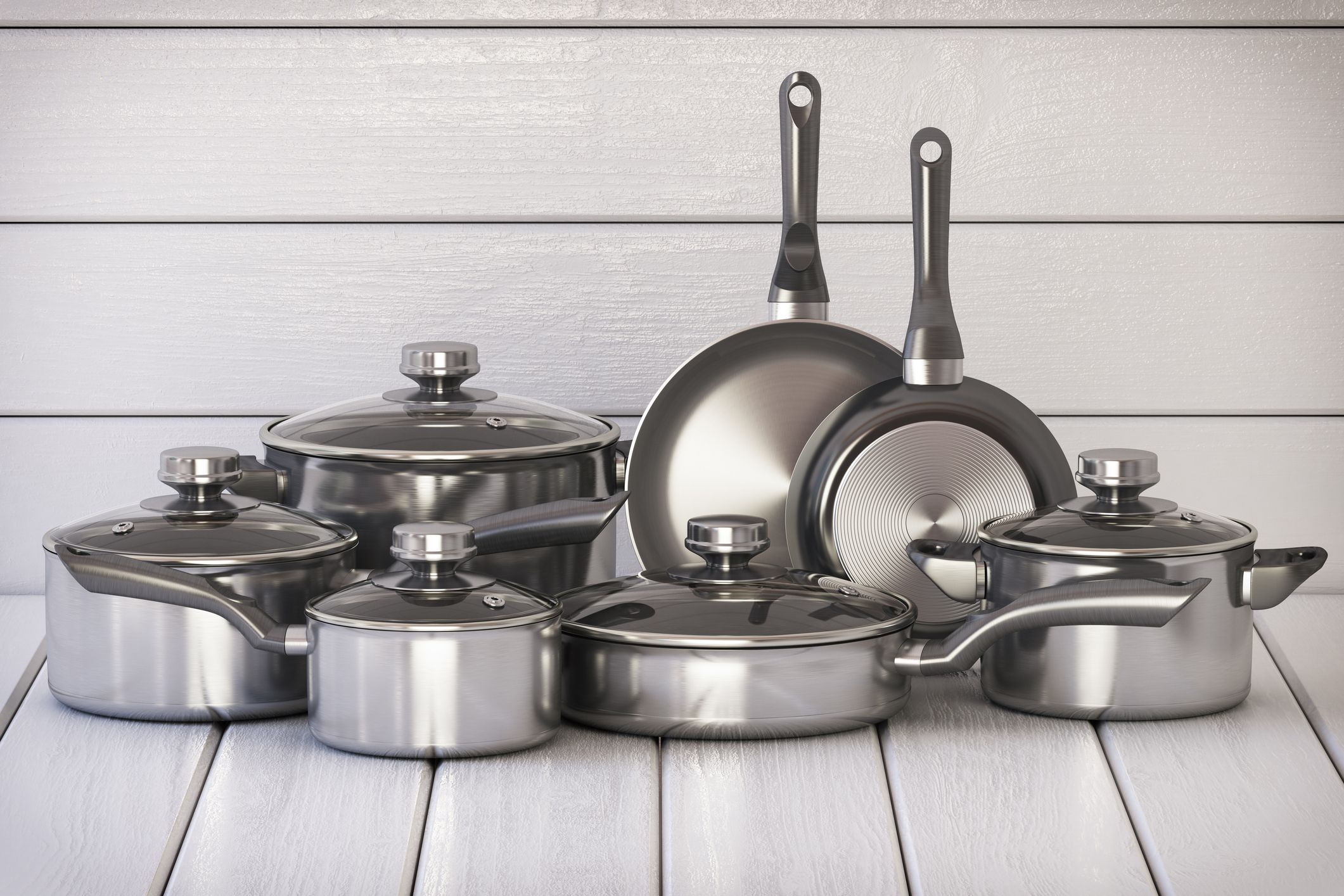 https://hips.hearstapps.com/hmg-prod/images/set-of-stainless-pots-and-pan-with-glass-lids-on-royalty-free-image-1573486021.jpg