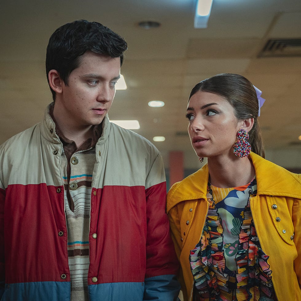 Two individuals standing together introduce a unique fashion style Two individuals standing together introduce a unique fashion style