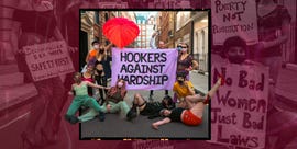 group of individuals protesting for sex worker rights holding supportive banners