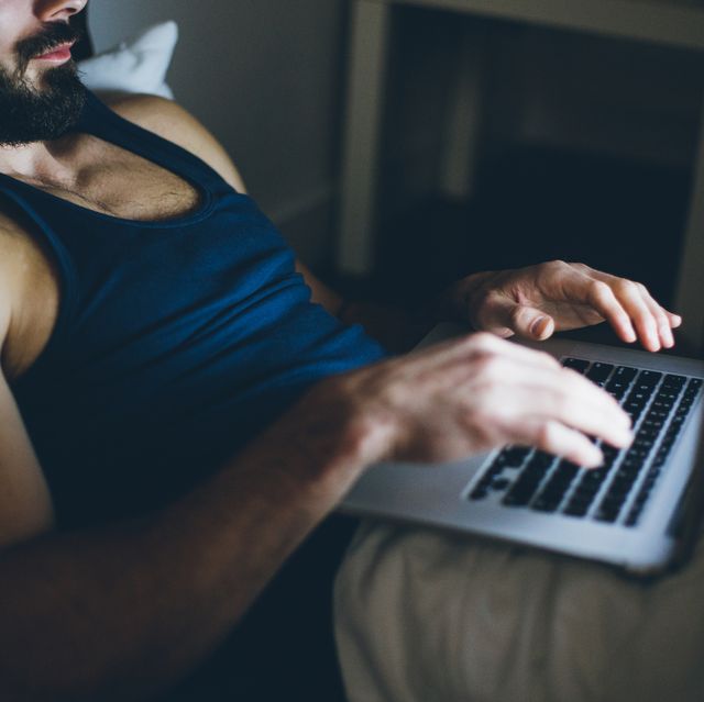 Sexy Man Working on Laptop