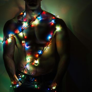 Sexy Santa, Christmas lights on shirtless unrecognizable man