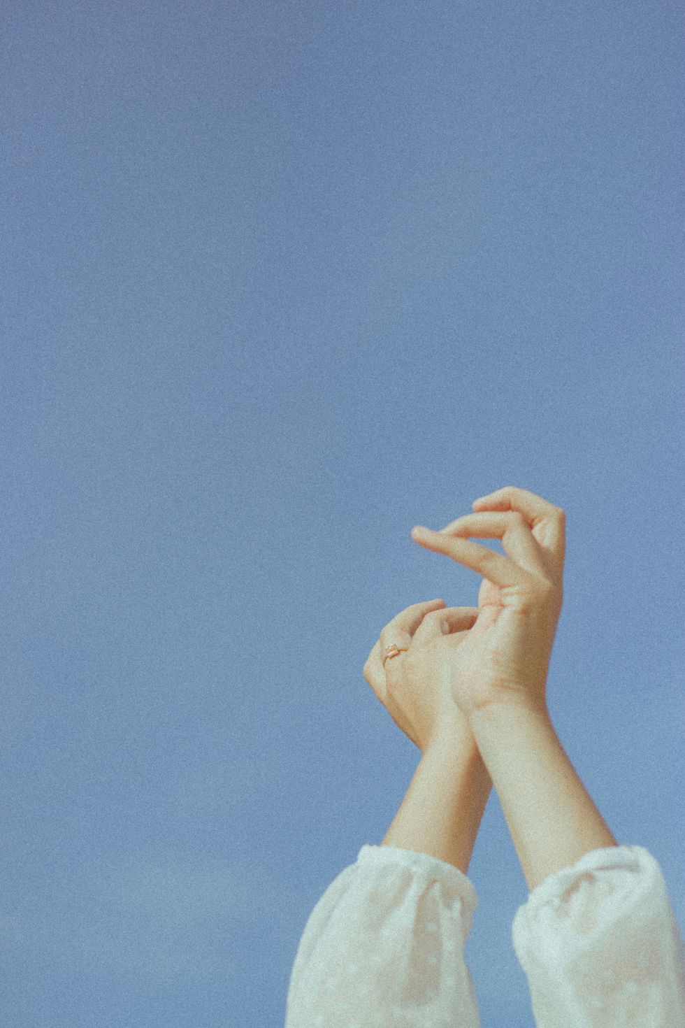 a pair of hands on a blue background