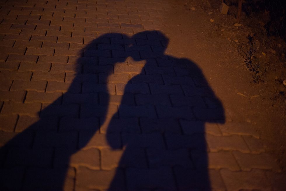Shadow Of A Couple Kissing