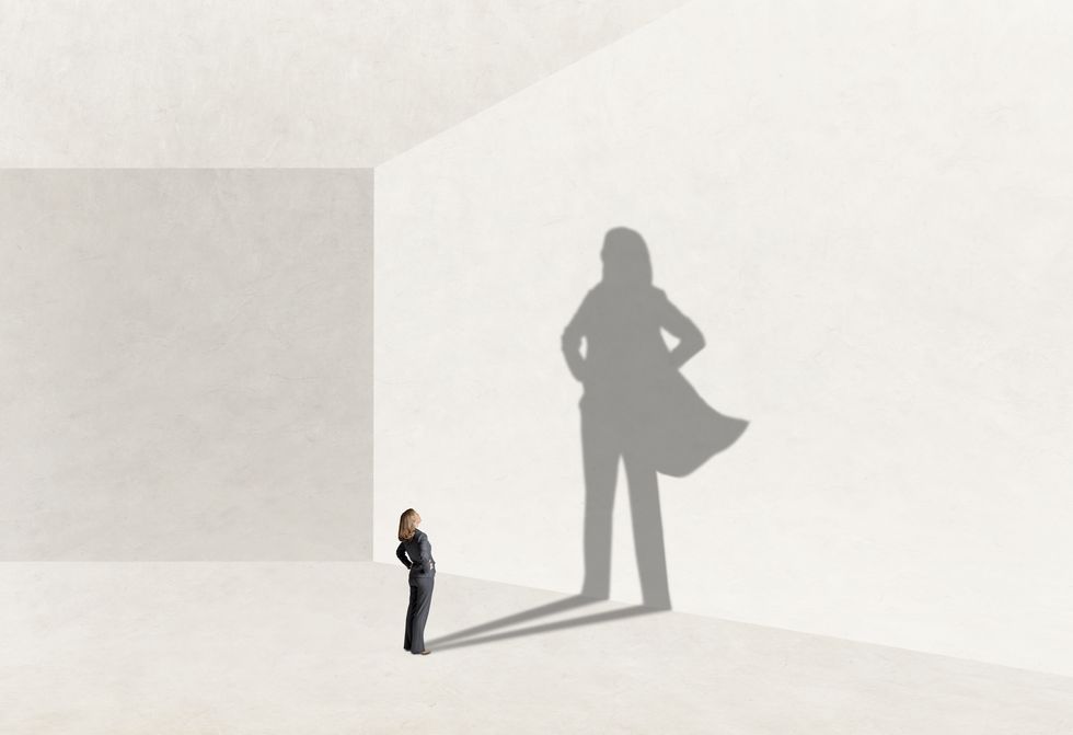 shadow of woman aspiring to confidence