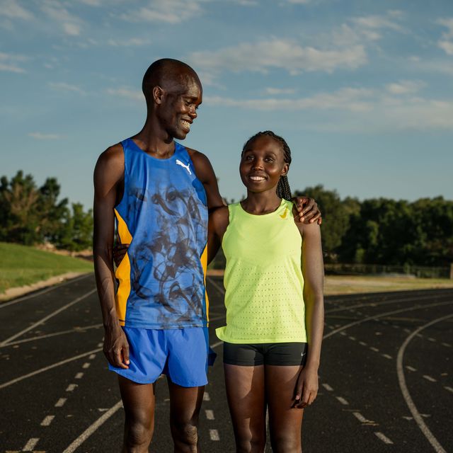 a man and woman standing on a track