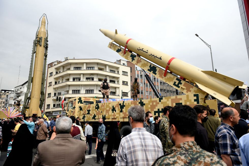 shahab 3, left, and khaibar buster missiles displayed