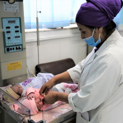 shahla oruzgani﻿ treating a baby at malalai maternity hospital in kabul