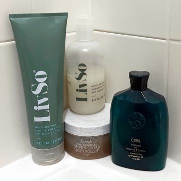 livso fresh and oribe shampoo in corner of shower