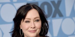shannen doherty smiling for a photo during arrivals for a fox event