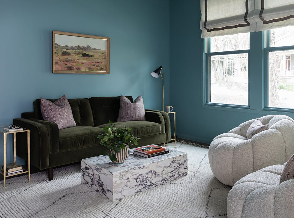 teal living room with green couch