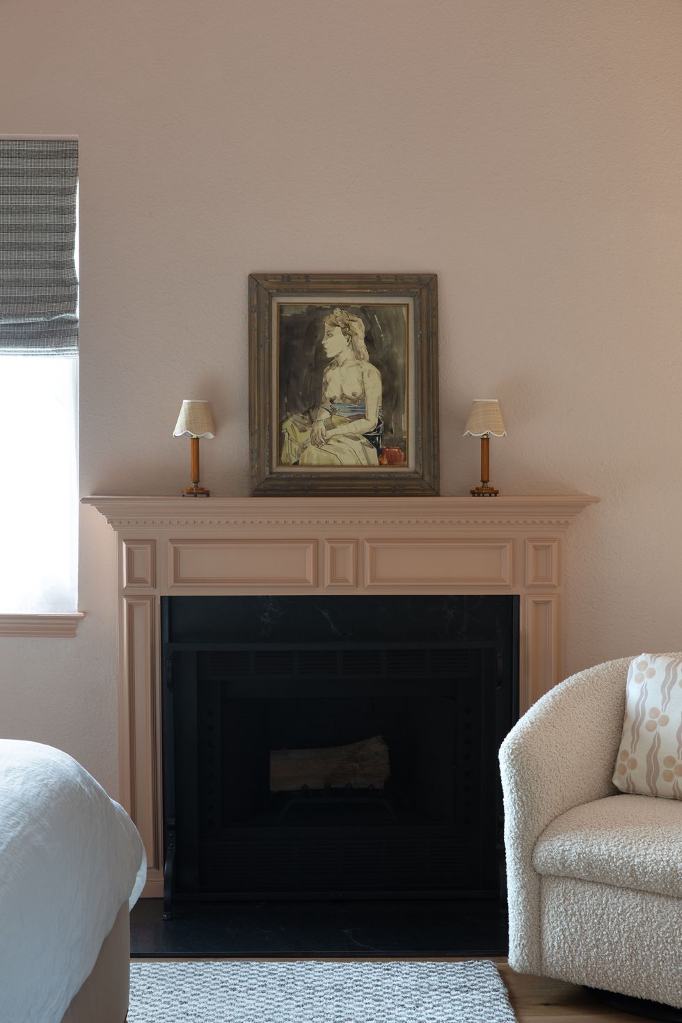 blush bedroom walls and fireplace