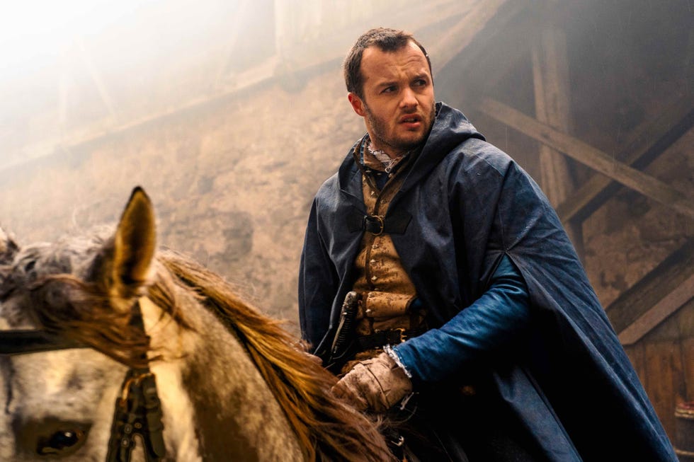 Medieval figure on horseback in a misty environment