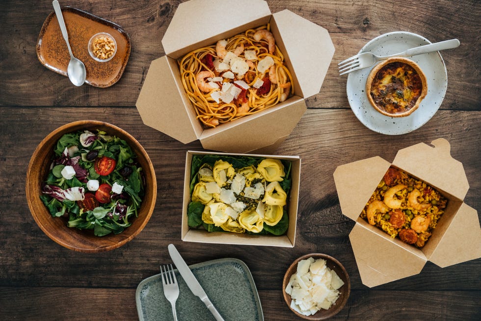 sharing takeaway meal on dining table