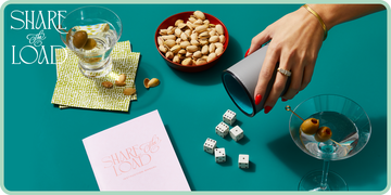 woman with red nails shaking dice