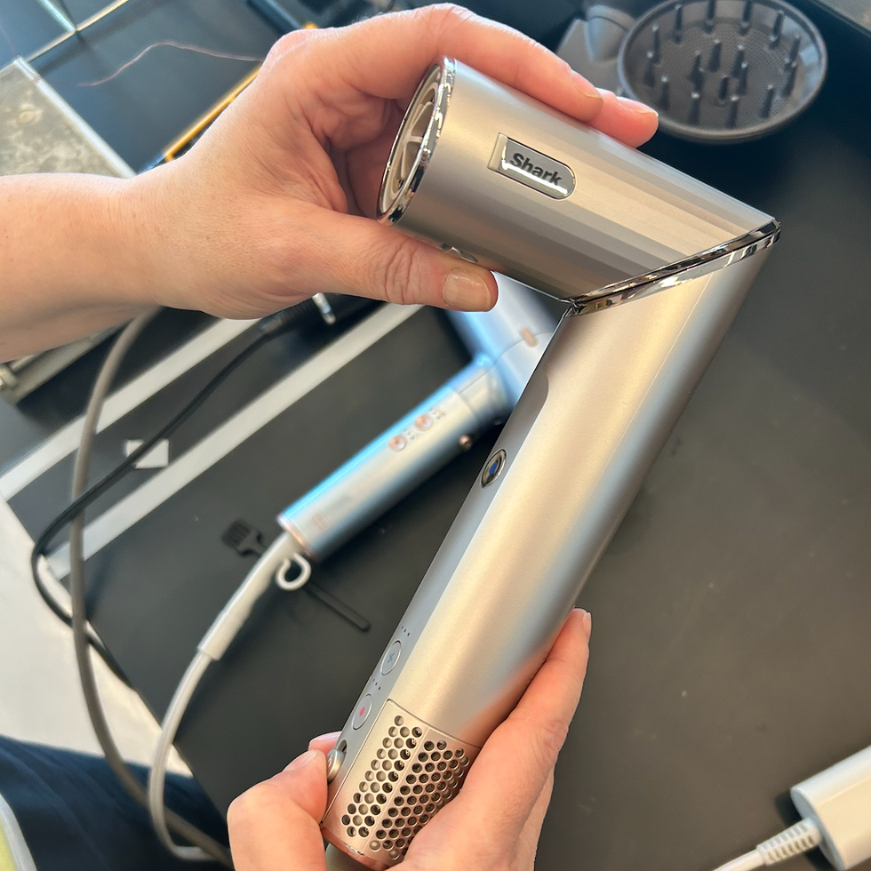 a testing photo of a shark hair dryer, one of good housekeeping's picks for best travel hair dryers