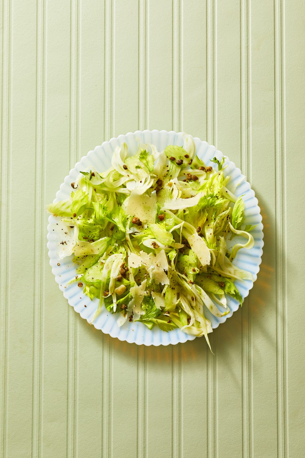 shaved fennel and celery salad on a blue plate
