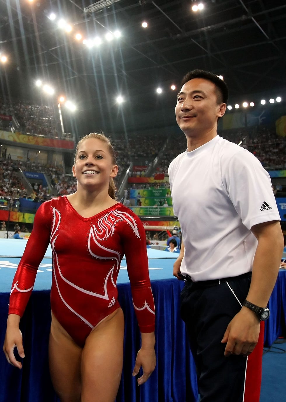 beijing august 13 shawn johnson of the united states and liang chow look on during the women's team artistic gymnastics final at the national indoor stadium during day 5 of the beijing 2008 olympic games on august 13, 2008 in beijing, china photo by al bellogetty images