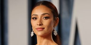 actress shay mitchell juicy with her hair up and dangly earrings