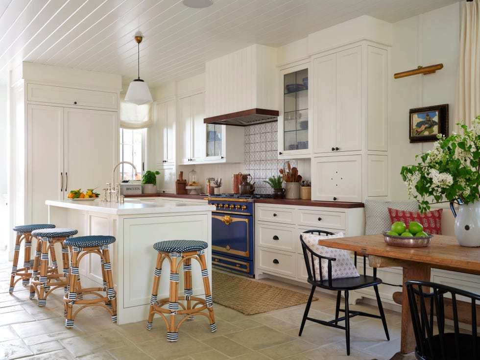 White coastal kitchen with blue and white stools