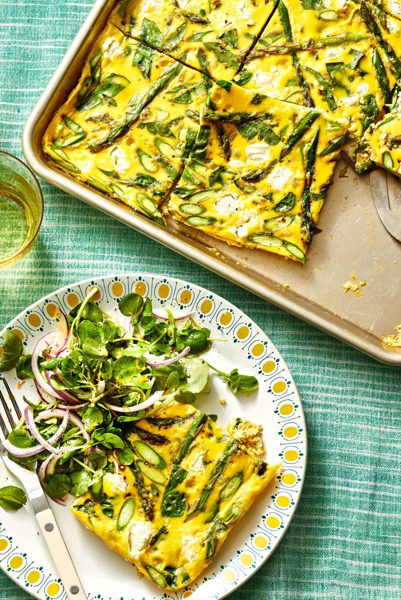 sheet pan asparagus frittata with a side salad on a plate