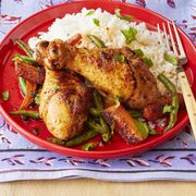 sheet pan dinners curried chicken and rice on red plate