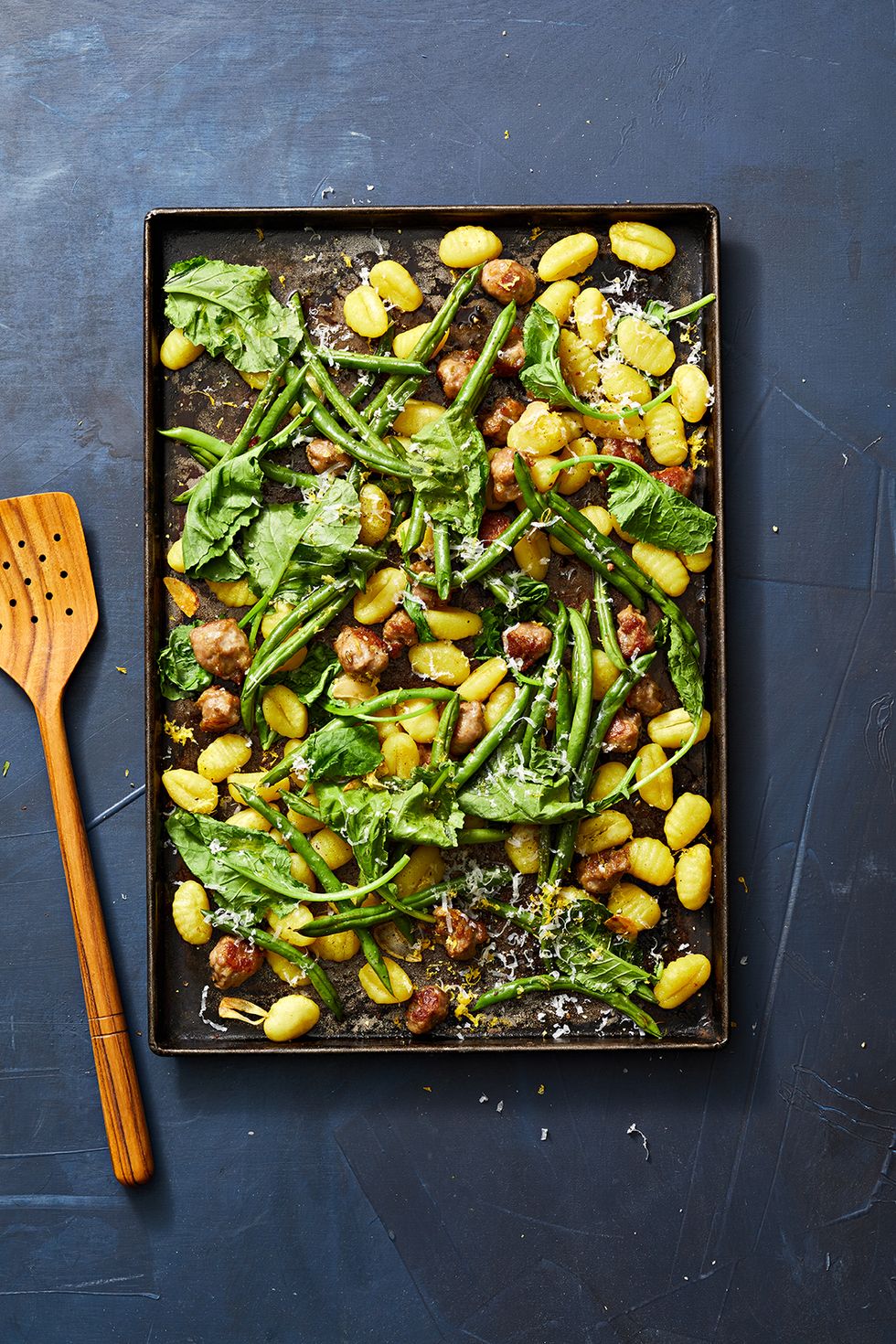 gnocchi with green beans and kale on a sheet pan