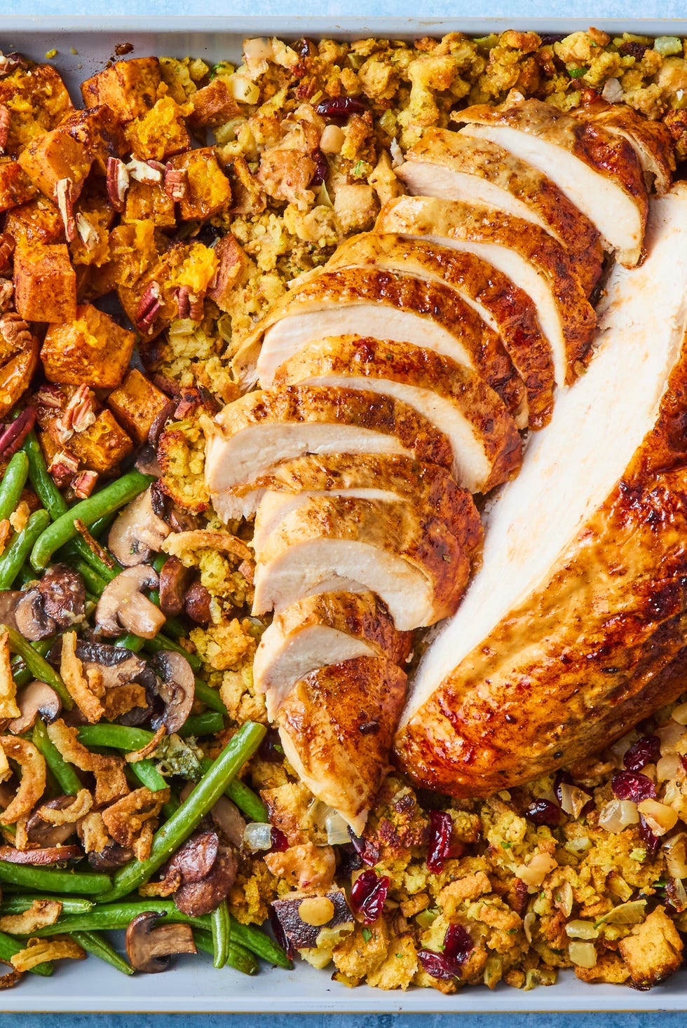 Sheet-Pan Thanksgiving Dinner turkey, stuffing, sweet potatoes, and green beans on a sheet pan