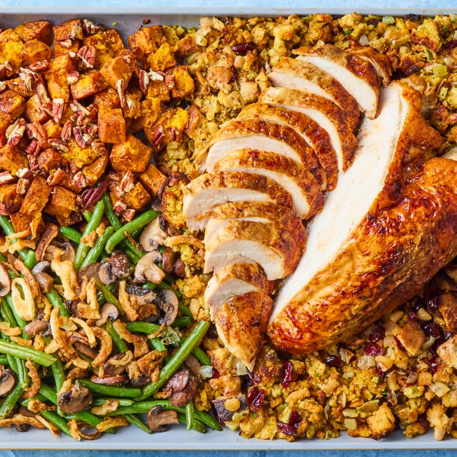 turkey, stuffing, sweet potatoes, and green beans on a sheet pan