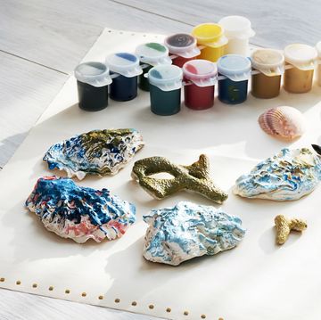 craft station with shells and coloured paints