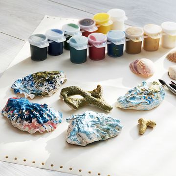 craft station with shells and coloured paints