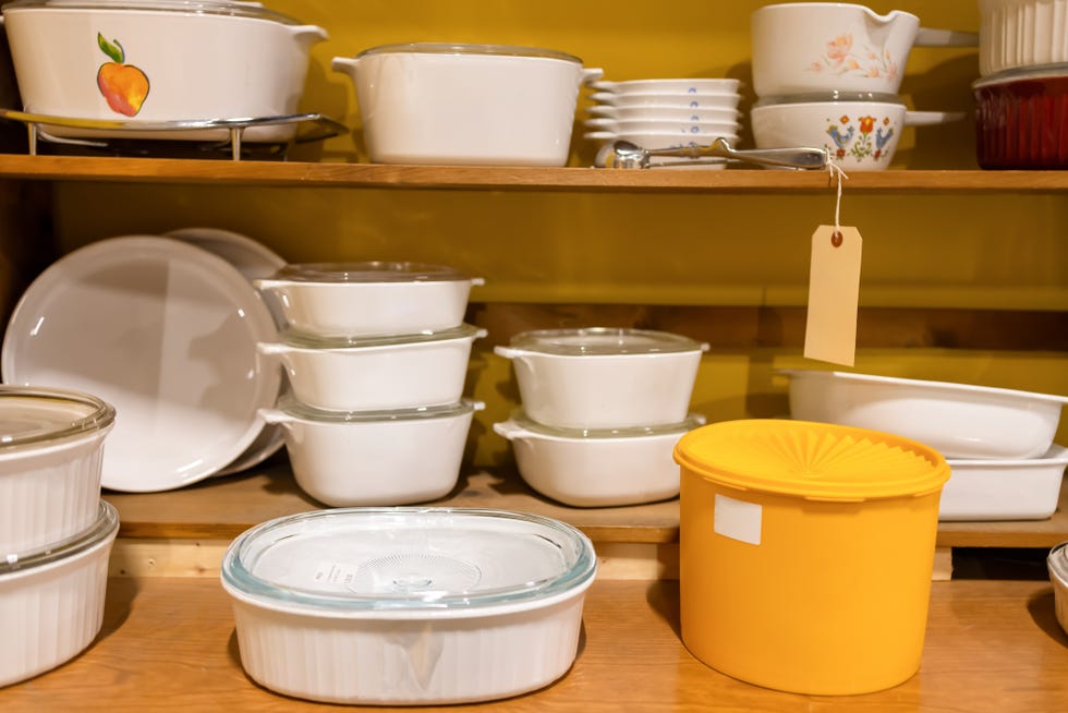 shelves of old fashioned kitchenware at antique flea market