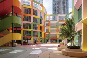 a multistory building with colorful windows