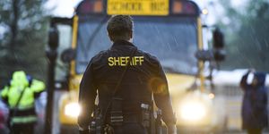 highlands ranch, co   may 07 a sheriffs officer watches as students get off busses after being evacuated to the recreation center at northridge after at least seven students were injured during a shooting at stem school highlands ranch on may 7, 2019 in highlands ranch, colorado photo by michael ciaglogetty images