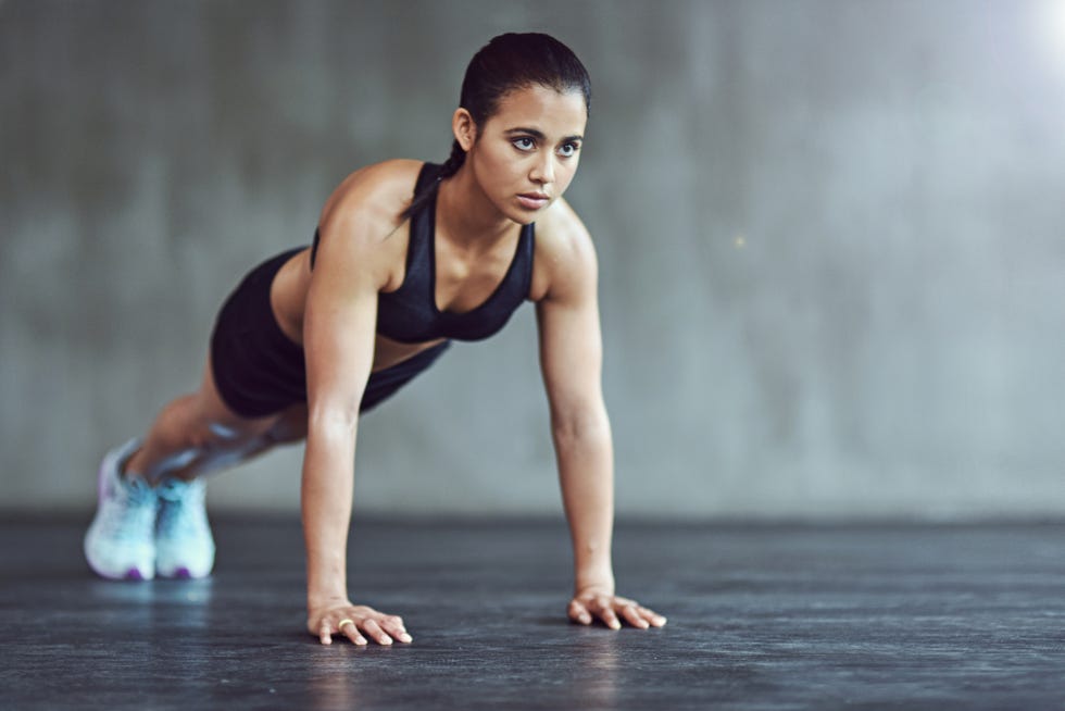 Woman doing incline push ups exercise Royalty Free Vector