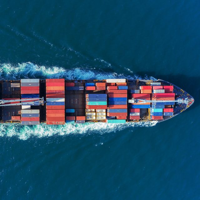 aerial view top speed with beautiful wave of container ship full load container with crane loading container for logistics import  export or transportation concept background