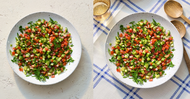 shirazi salad in bowl with chopped cucumbers and chopped tomatoes and fresh herbs