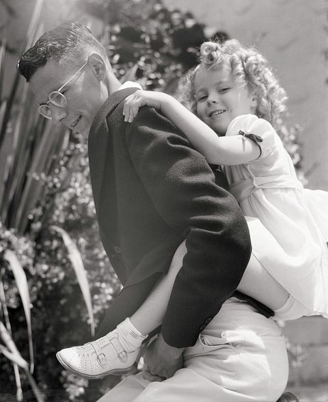 shirley temple getting a piggy back ride