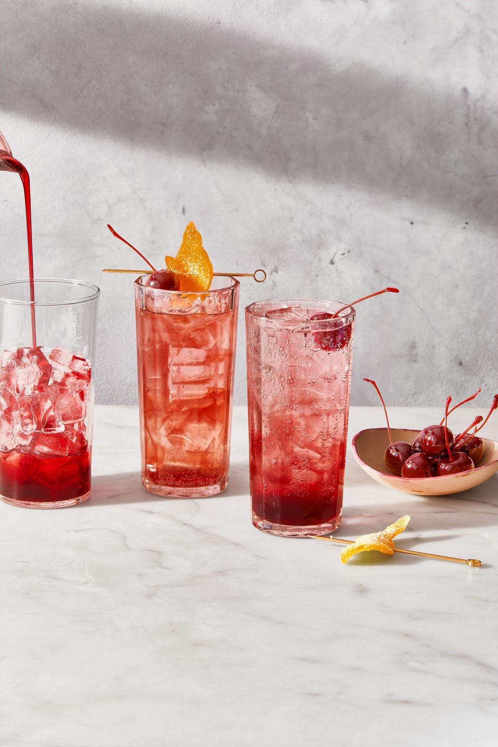 pink cocktails shirley temples on a marble surface
