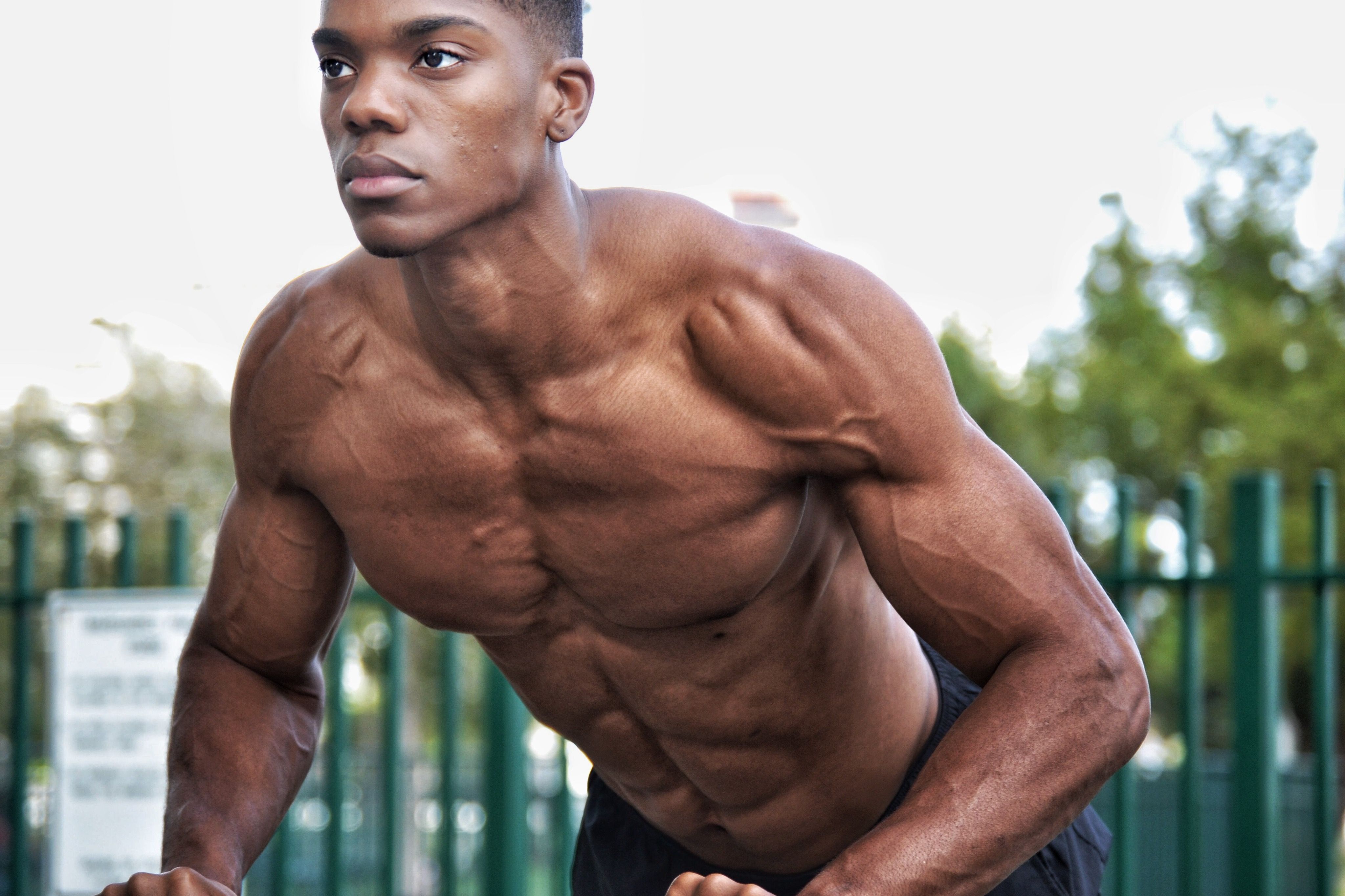 Man doing Standing cable crossover. cable flies exercise. Flat