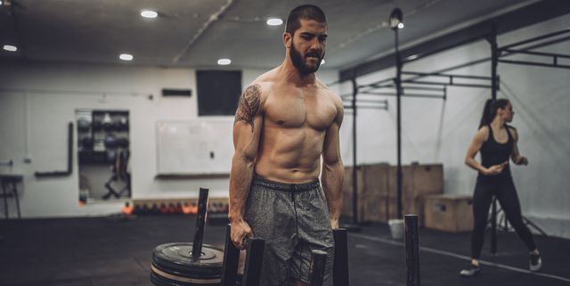 Shirtless man training hard
